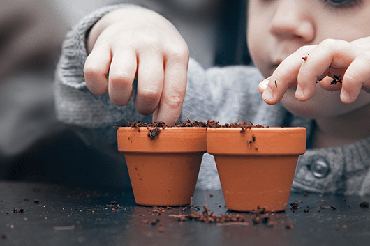 child with plants